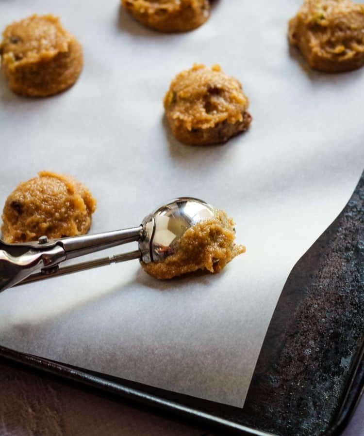 cookie dough on cookie sheet with scoop