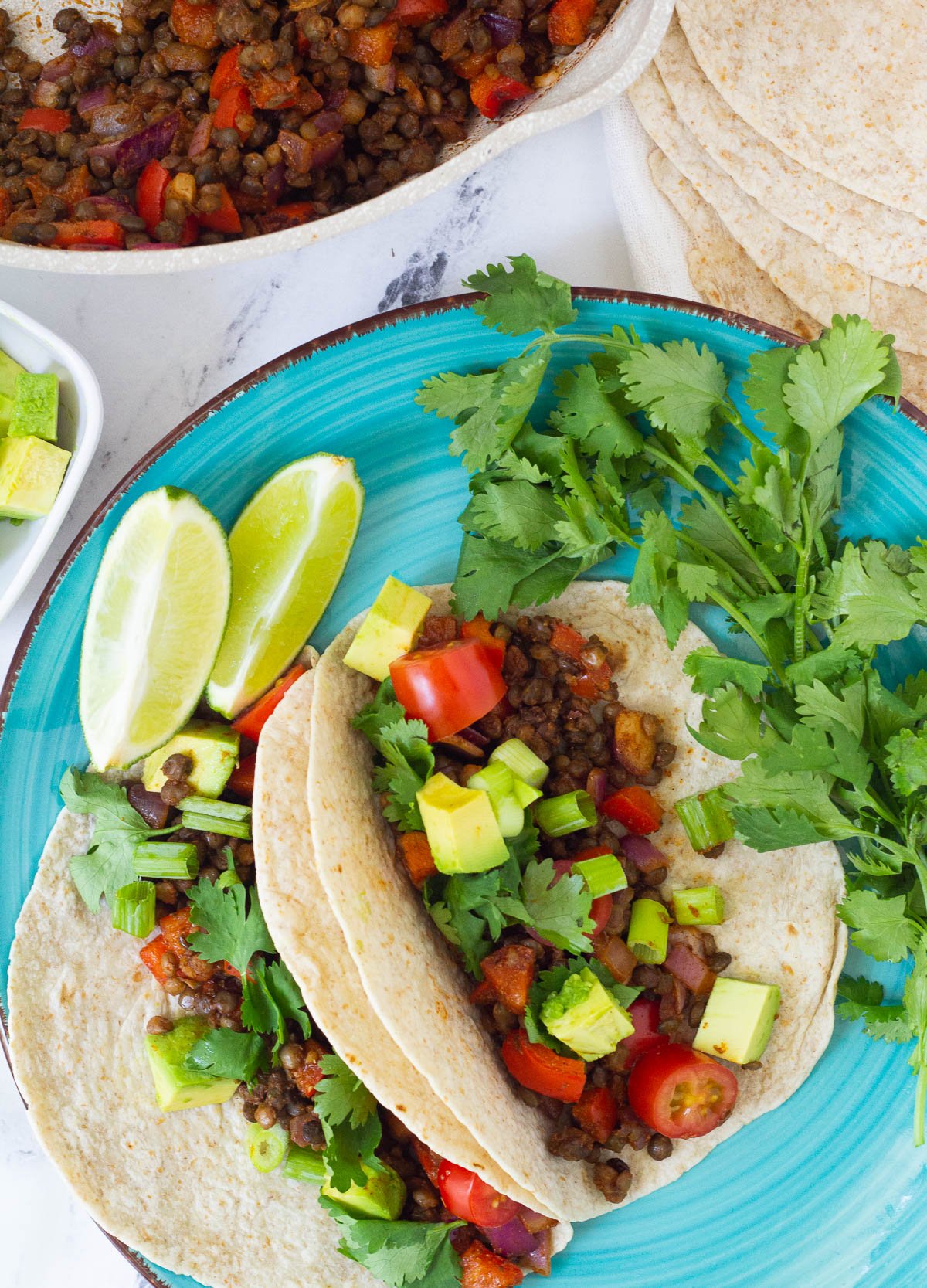 veganuary recipes: lentil tacos on turquoise plate