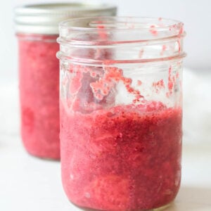 homemade low sugar strawberry jam in two mason jars