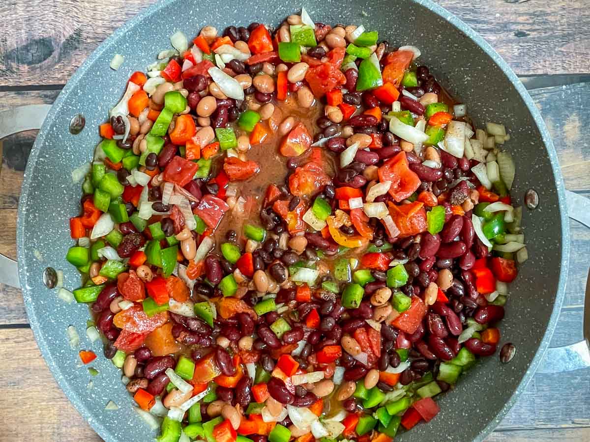 Three bean chili in Dutch oven.