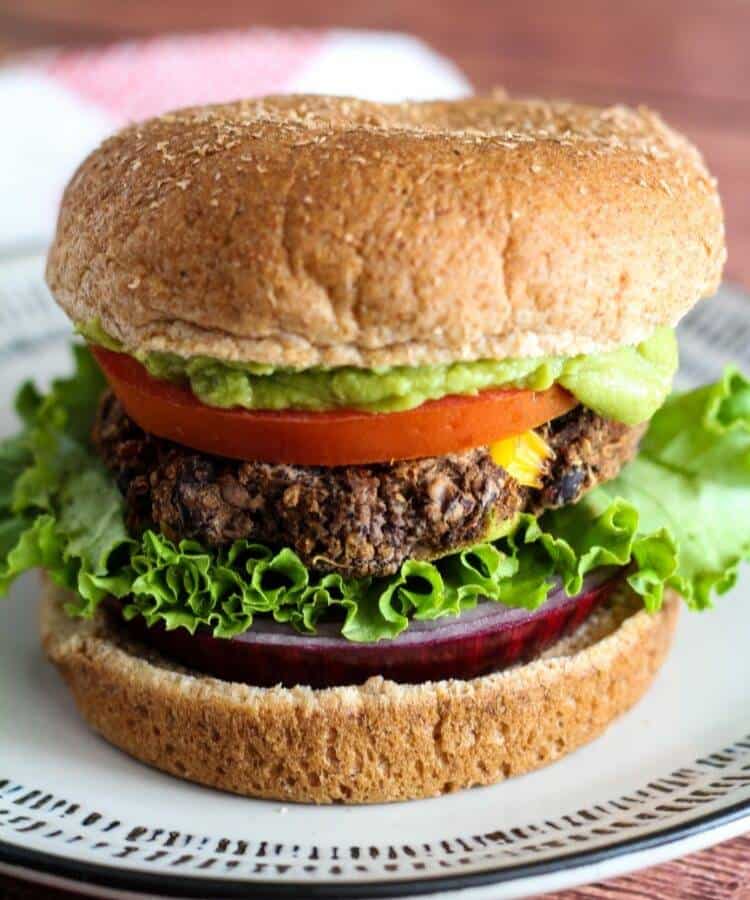 veganuary recipes: black bean quinoa burger on white plate
