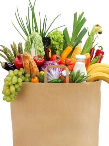 brown bag of groceries willed with fresh fruits, and vegetables