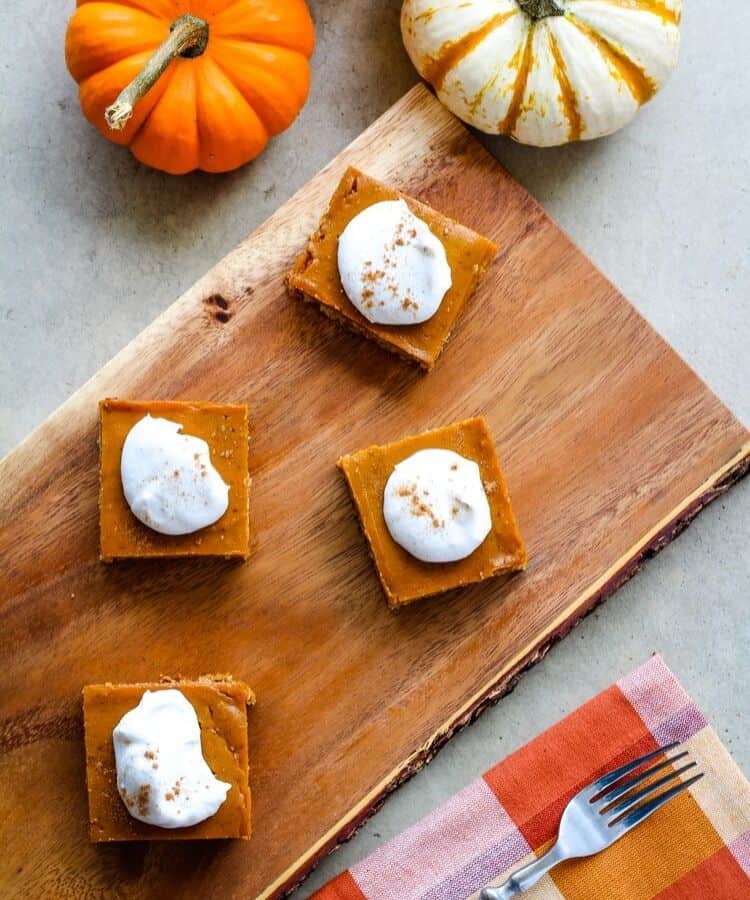 Healthy pumpkin bars on wood serving platter.