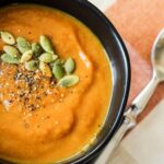 vegan pumpkin soup in black bowl
