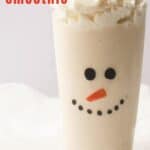 Snowman Christmas smoothie in tall cup with whipped cream.