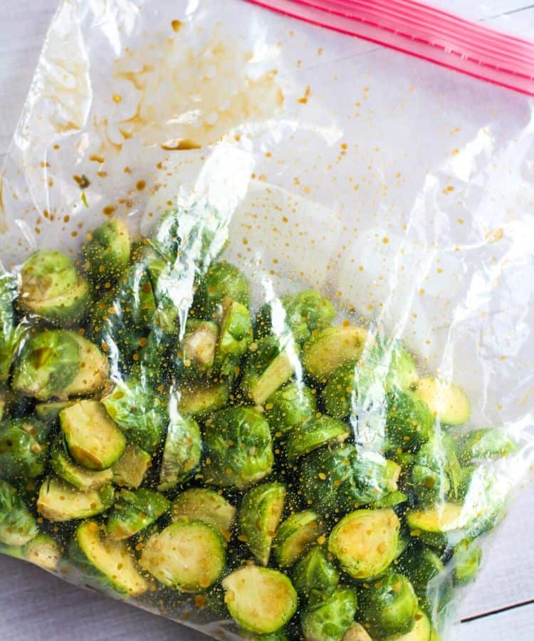 Brussel sprouts and marinade in zip-lock bag.