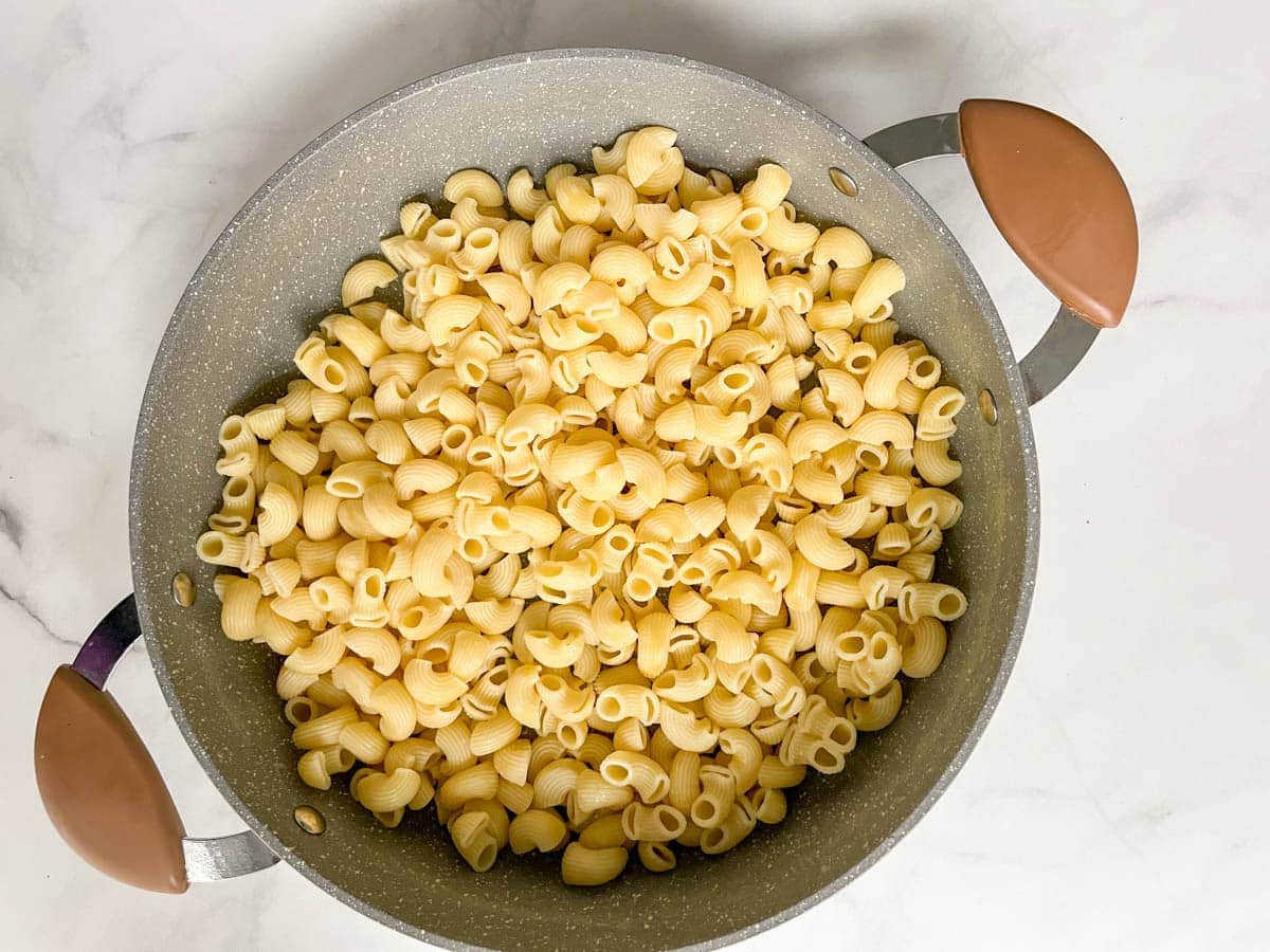 Cooked and drained macaroni in pot.