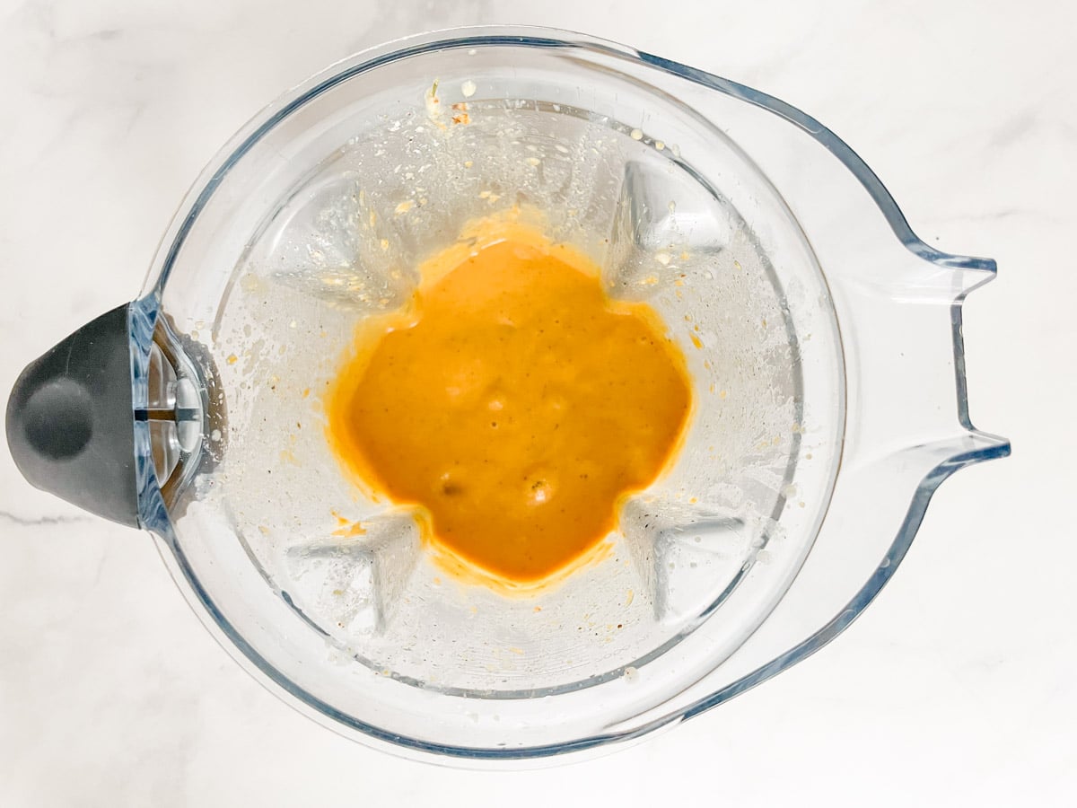 Blended butternut squash "cheese" sauce in blender.