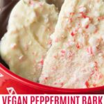 Peppermint bark in candy cane bowl.