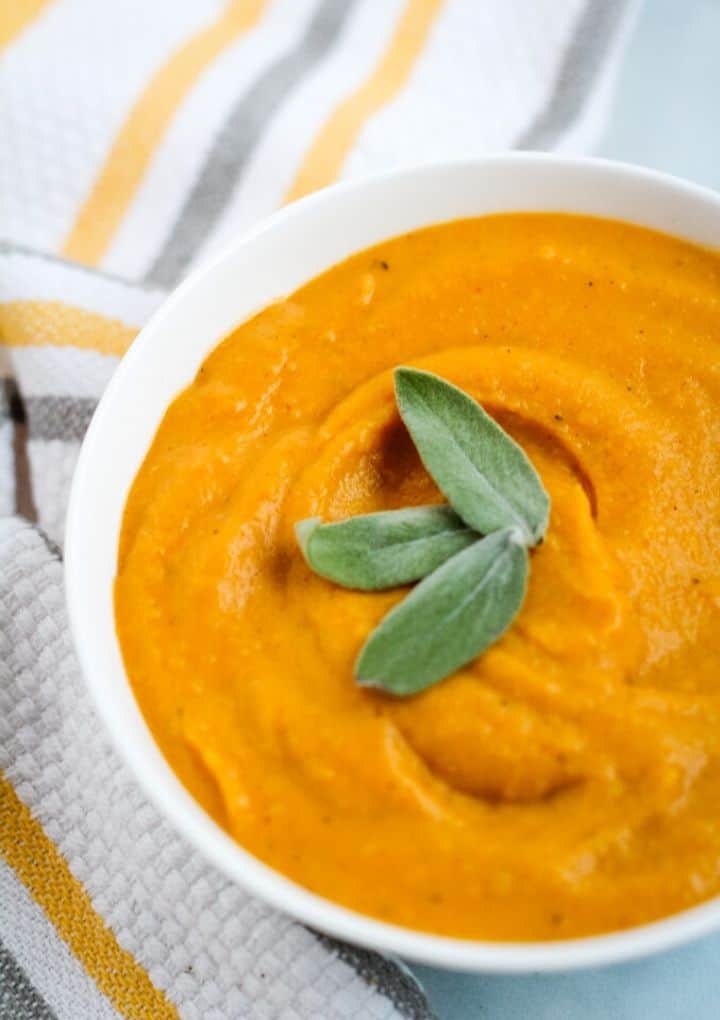 vegan butternut squash soup with sage leaves