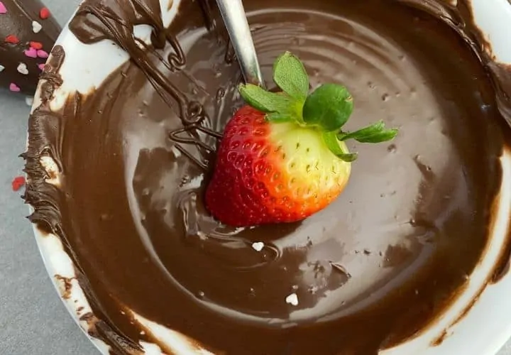 Strawberry dipped in melted chocolate.
