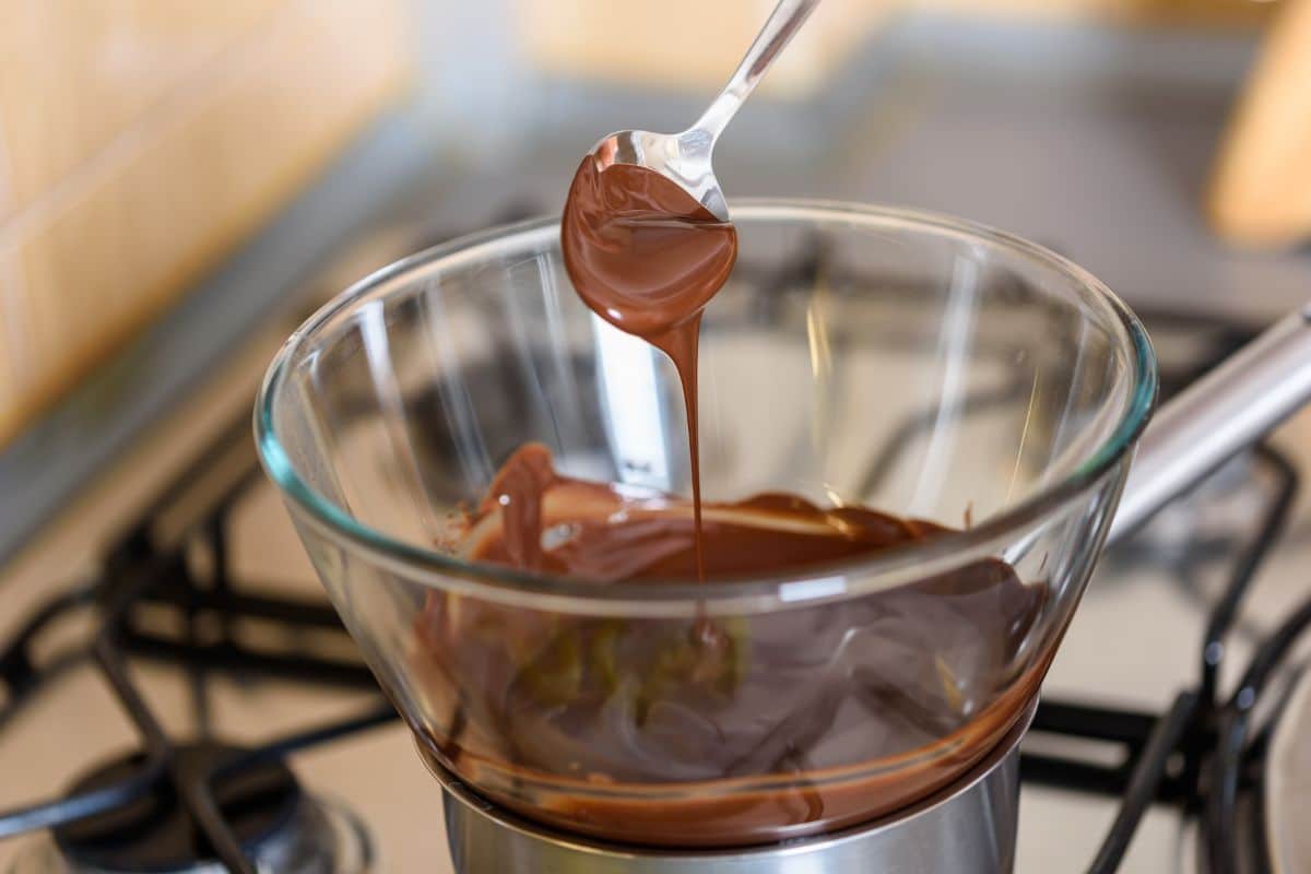 Melting chocolate over the stove.