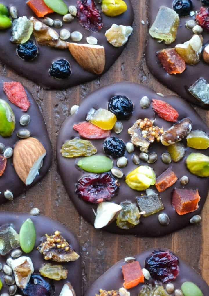 Dark Chocolate bites topped with fruit and nuts. 