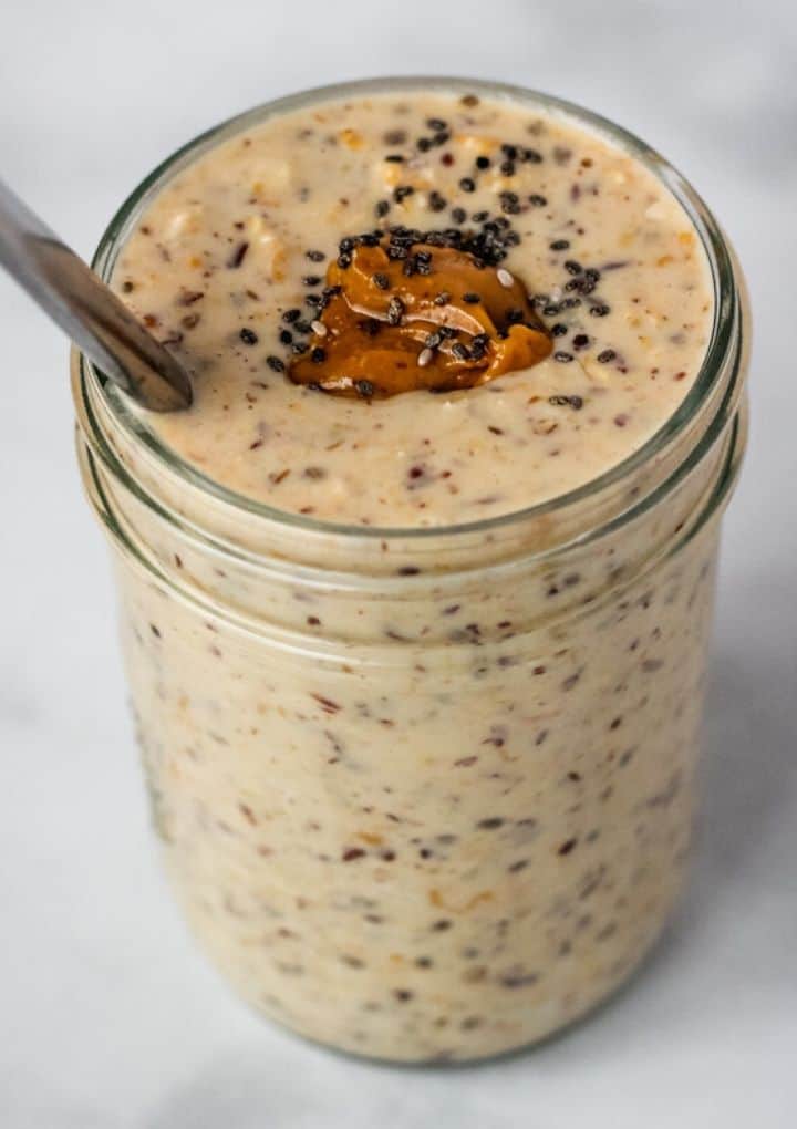 creamy oats topped with peanut butter in a mason jar
