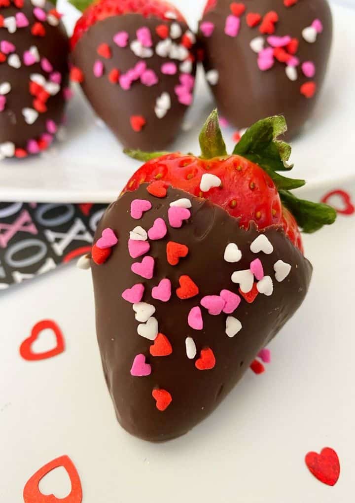 vegan chocolate covered strawberries with heart sprinkles