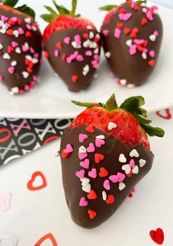 vegan chocolate covered strawberries with heart sprinkles