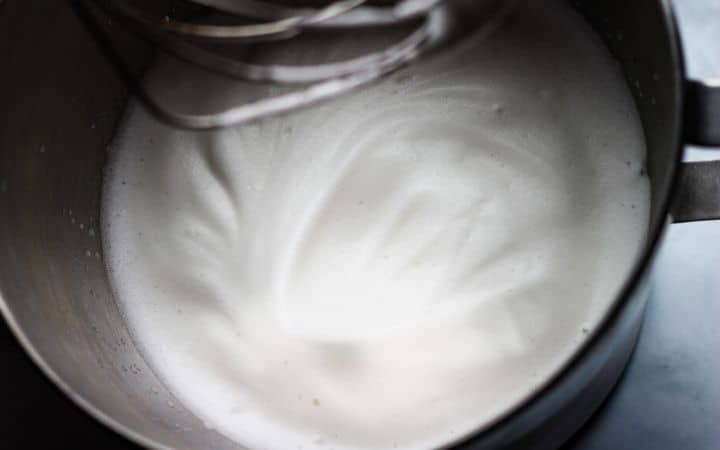 whipped aquafaba in mixer with stuff peaks