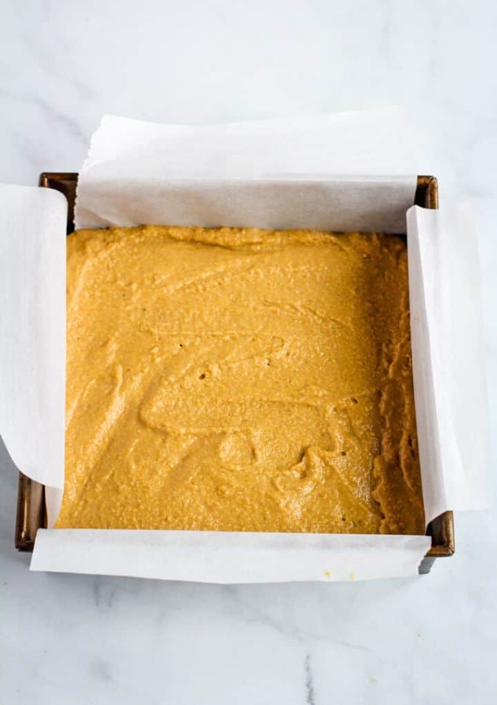 cornbread batter in pan lined with parchment paper