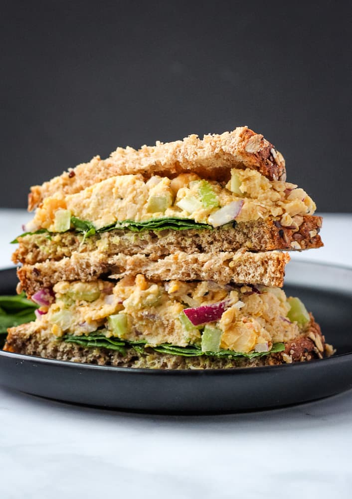 vegan tuna salad sandwich on black plate 
