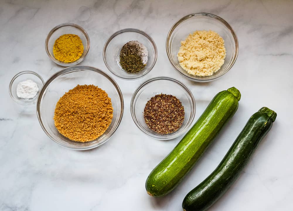 zucchini, breadcrumbs, and spices in bowls