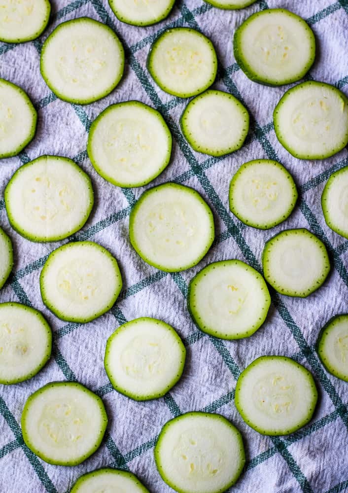 sliced zucchini on kitchen towel