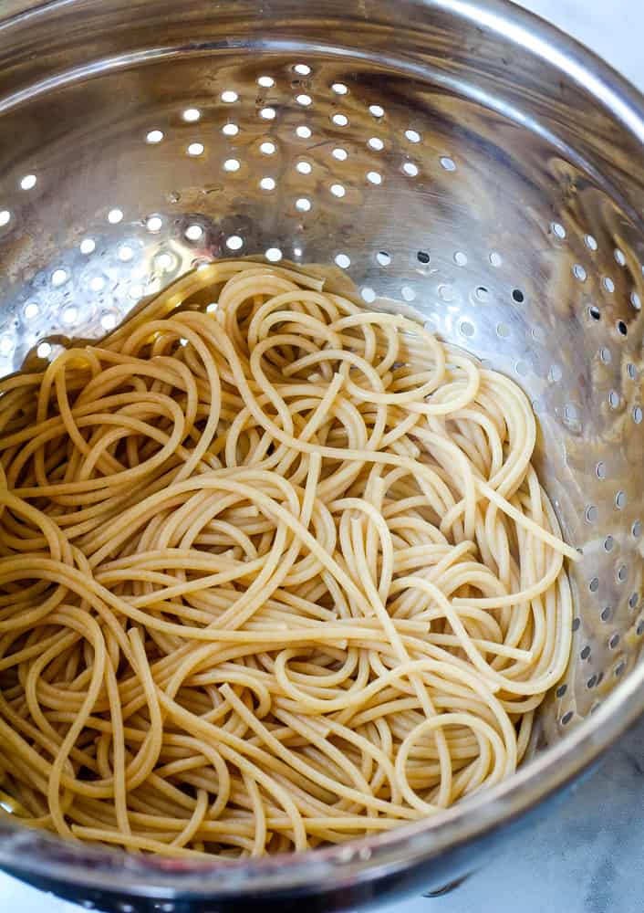 Whole wheat pasta drained in colander.
