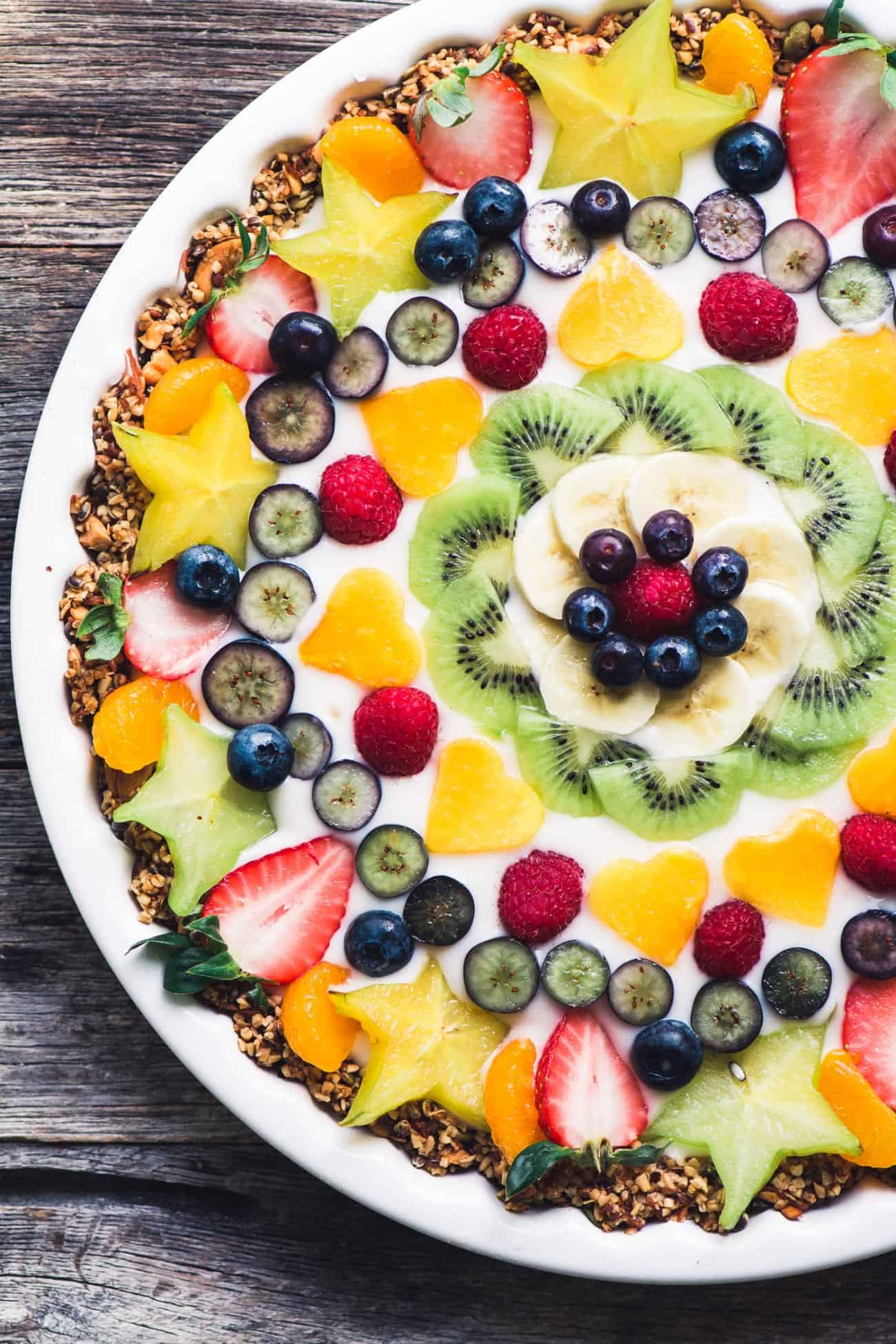 fruit tart topped with strawberries and other fruit