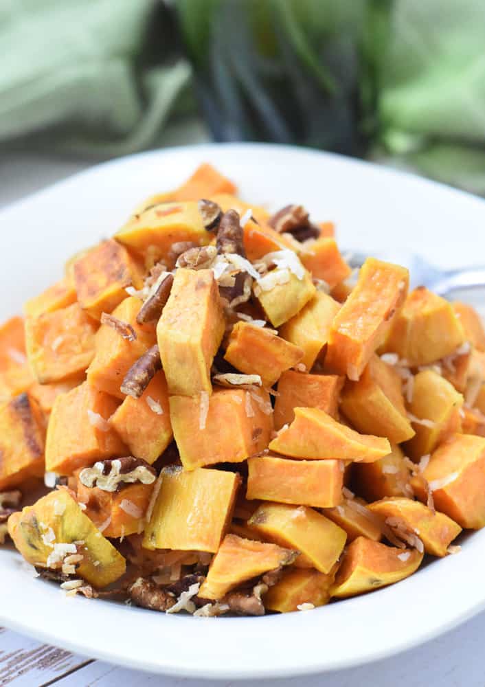 Sweet potatoes topped with coconut and pecans.