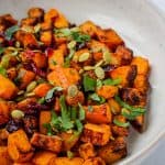 squash topped with parsley and cranberries