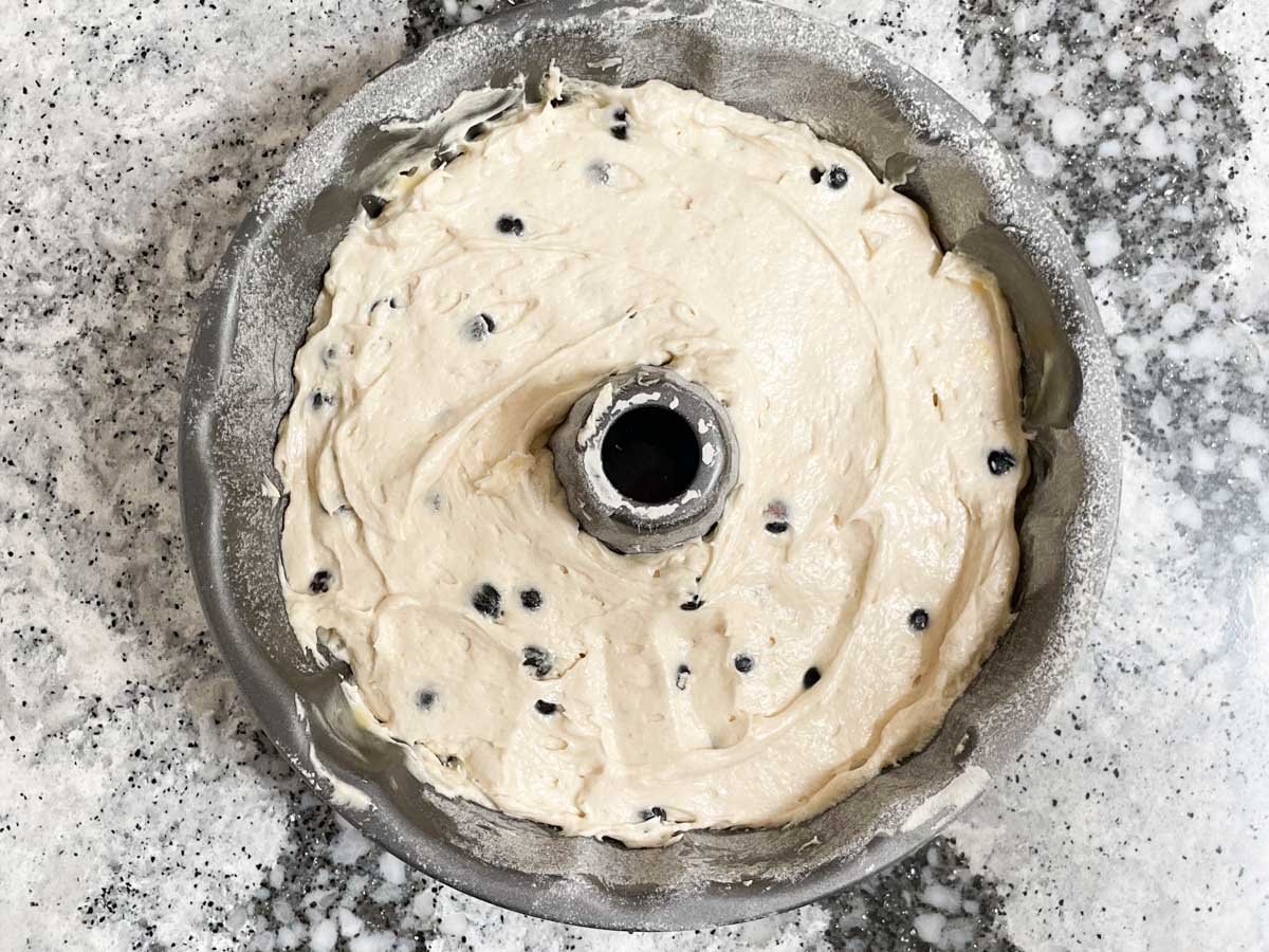 Blueberry lemon cake batter in bundt cake pan.

