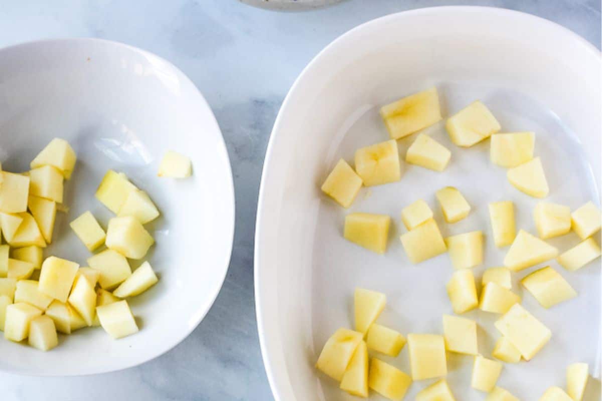 Sliced apple chunks in bowl and casserole dish.