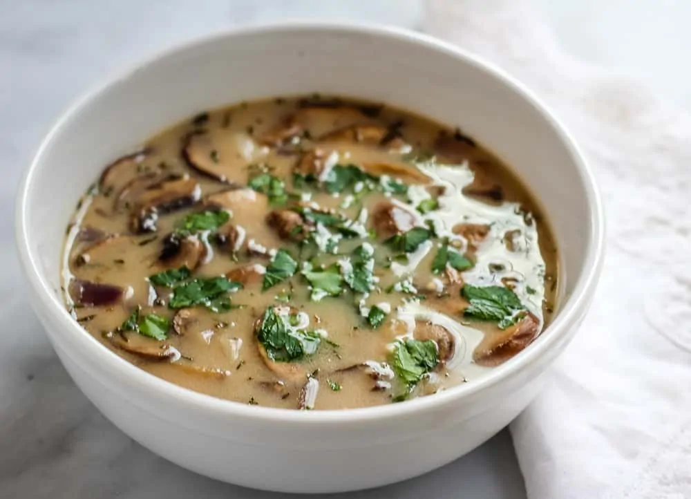 close up vegan mushroom soup with parsley