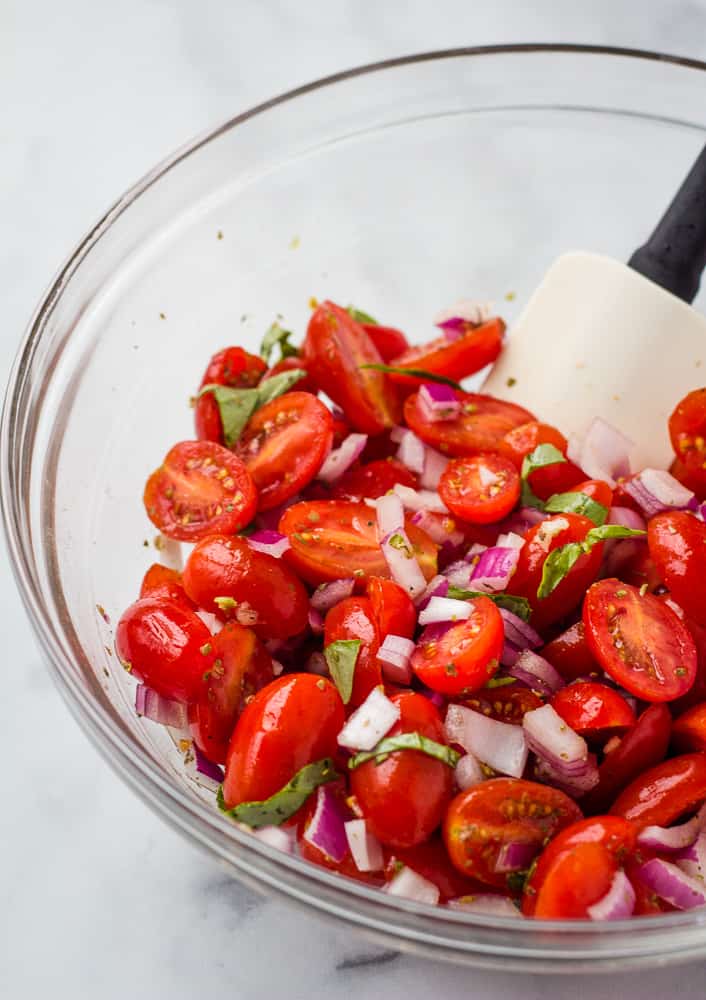 italian tomato salad in glass bowl