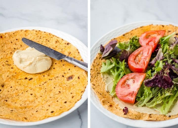 Lavash covered in hummus, lettuce, and tomato