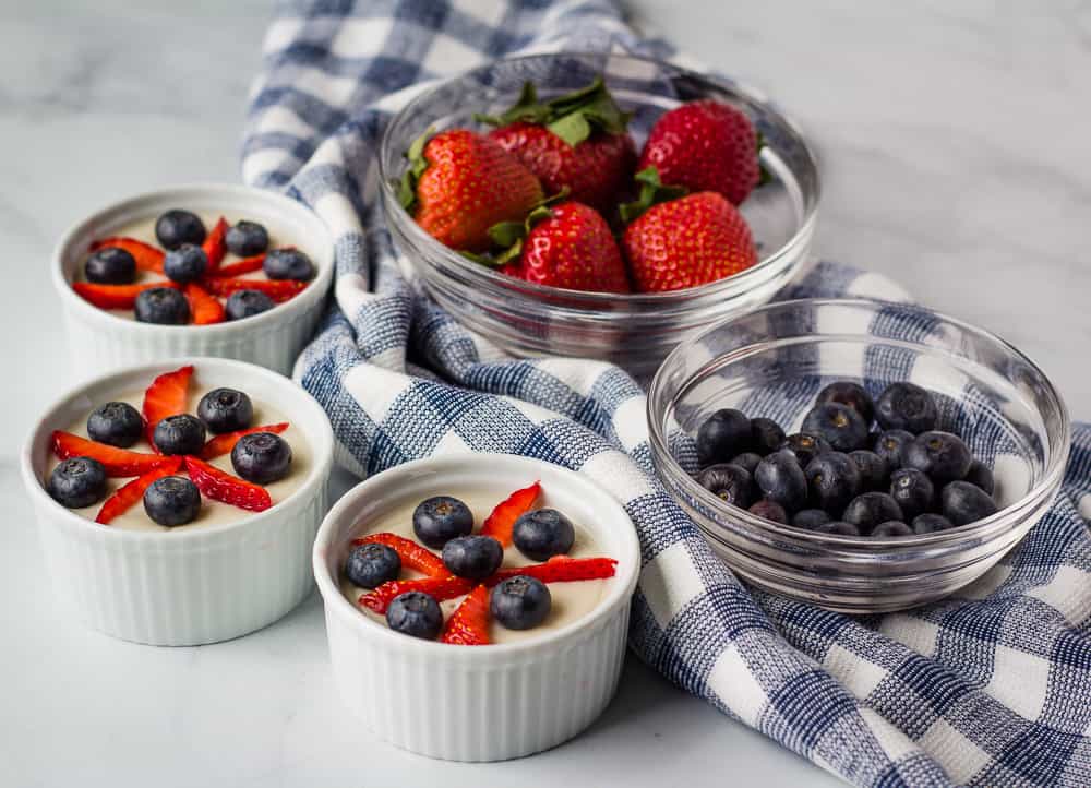 Vegan vanilla pudding with strawberries and blueberries.