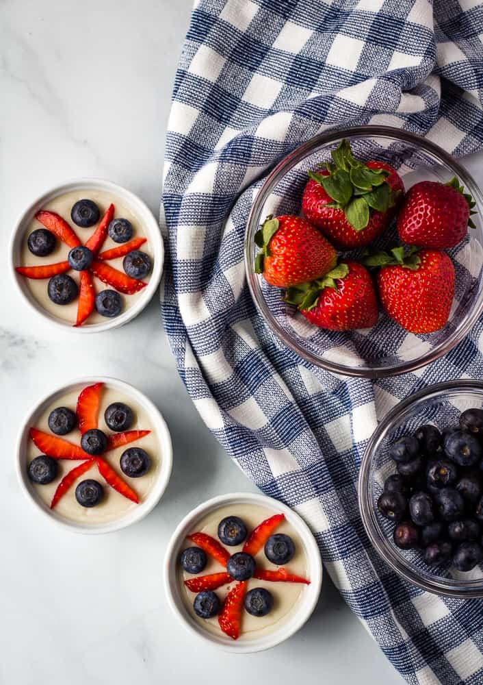 overhead vegan vanilla pudding with strawberries and blueberries