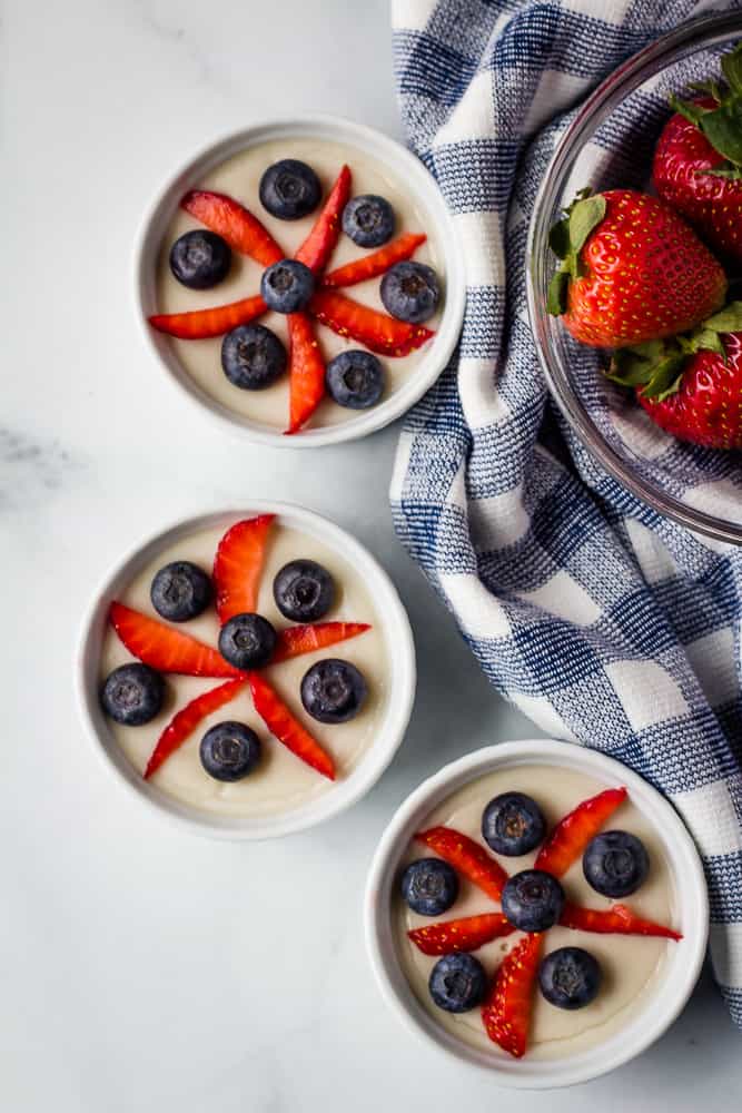 vegan vanilla pudding topped with strawberries and blueberries