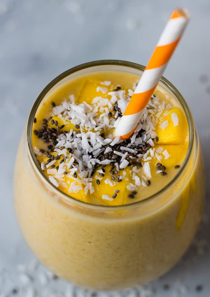 closeup of mango smoothie topped with chia seeds