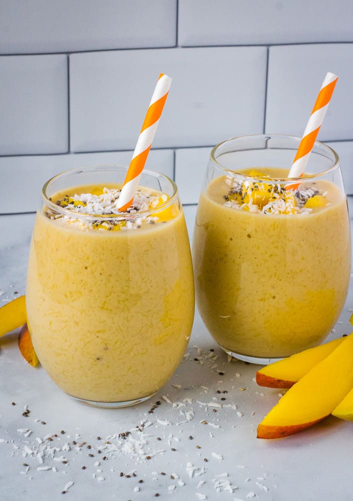two mango smoothies in glasses
