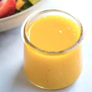 Mango dressing in small jar.