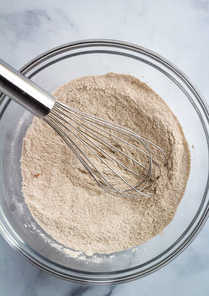 Flour in bowl with whisk.