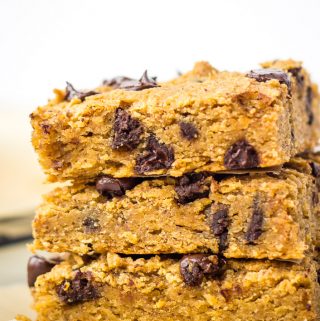 stack of 3 vegan blondies on parchment paper