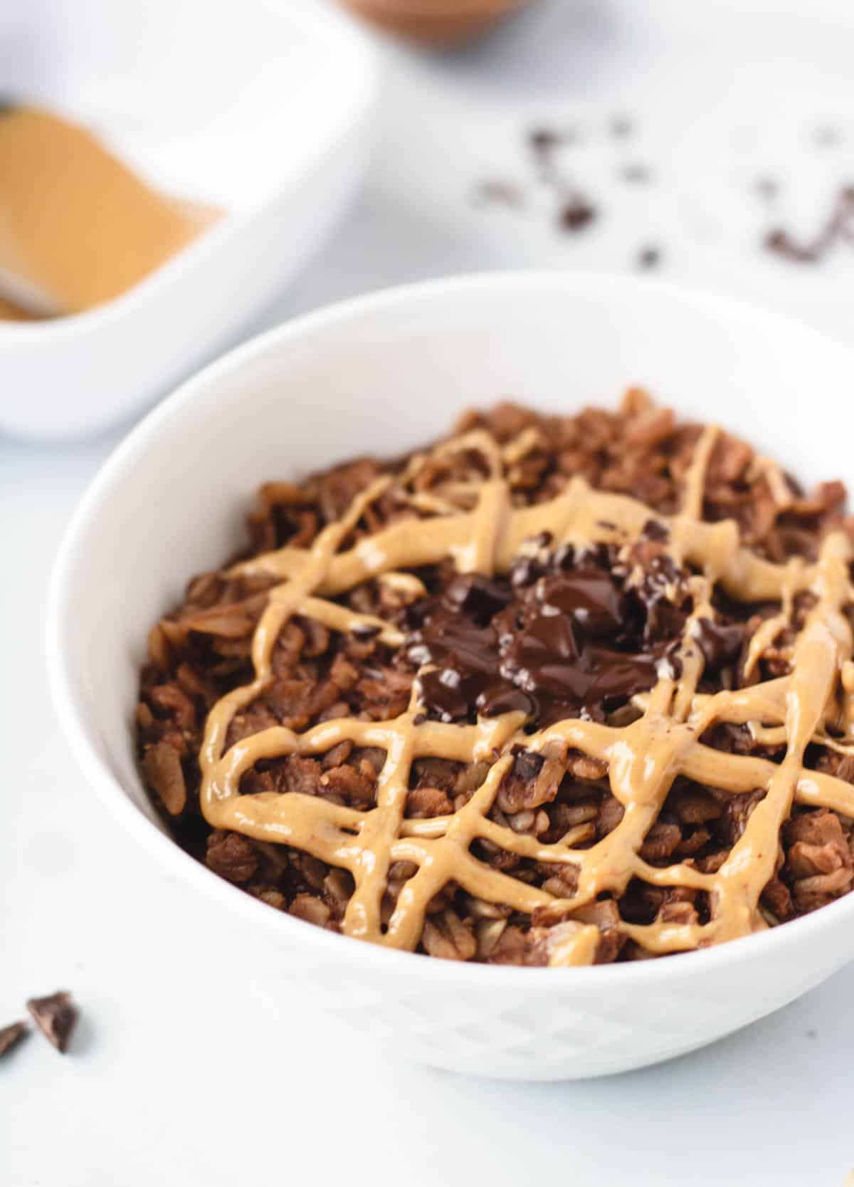 Brownie oatmeal drizzled with peanut butter.