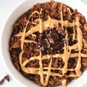 overhead of chocolate oatmeal topped with peanut butter