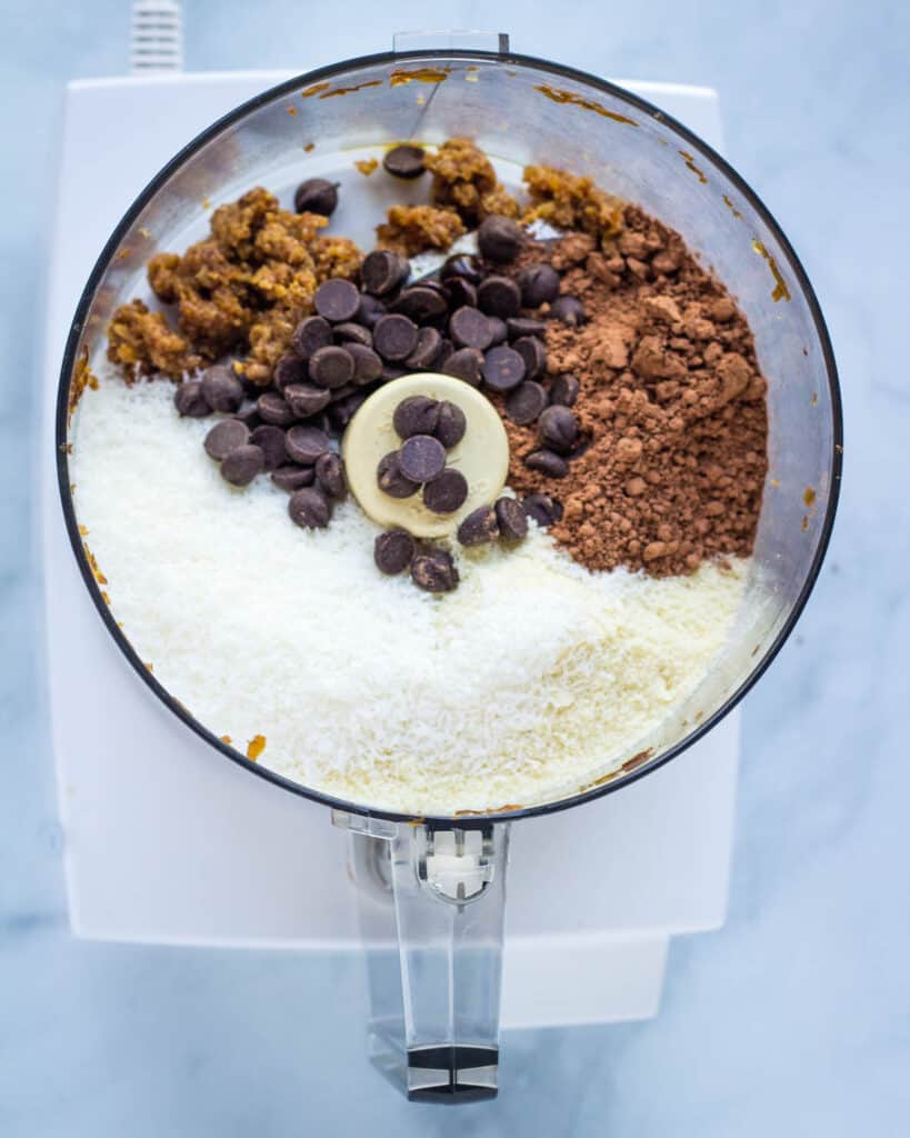 coconut, almond flour, cocoa, dates, and chocolate chips in food processor