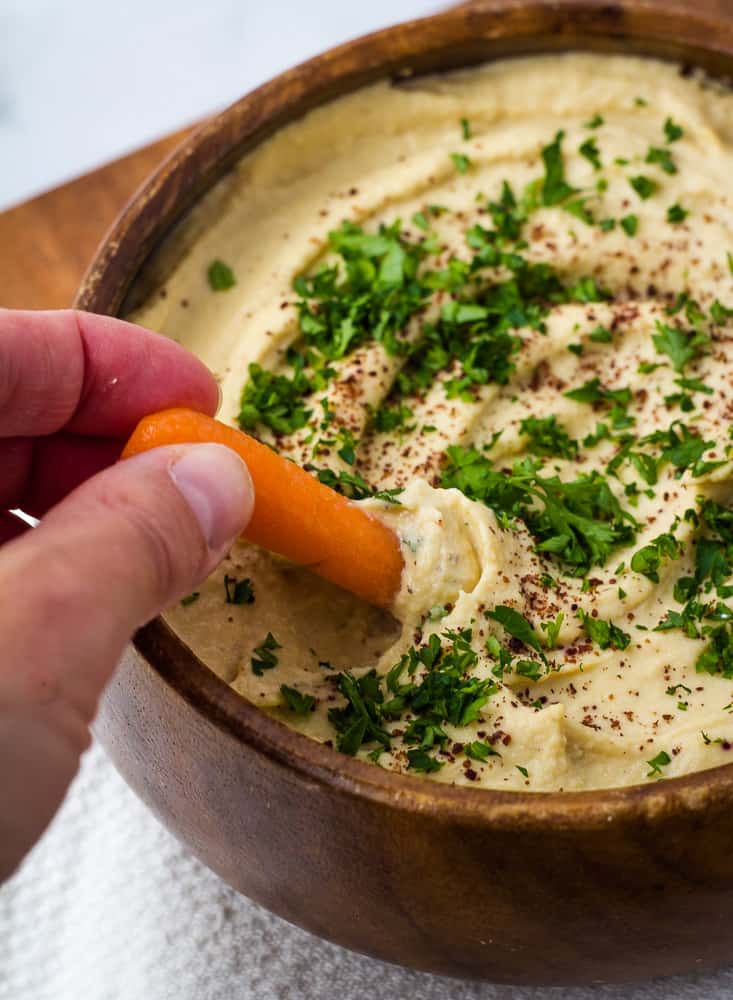 carrot dipped in hummus