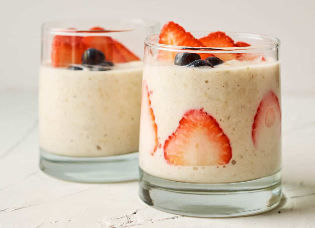 Protein overnight oats in glasses topped with berries