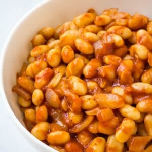 baked beans in white bowl