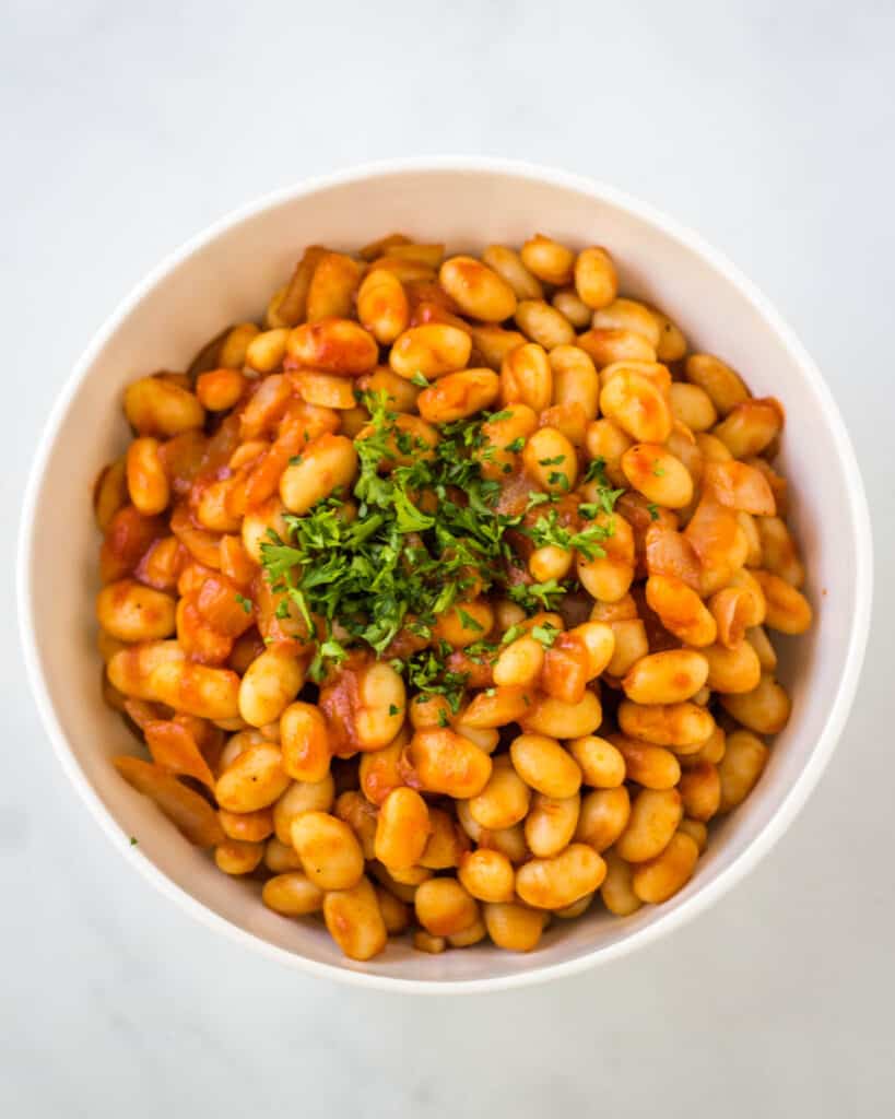 beans in bowl topped with parsley