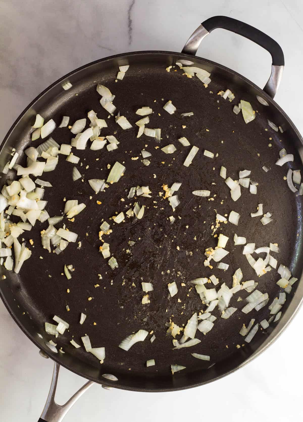 onions and garlic in skillet